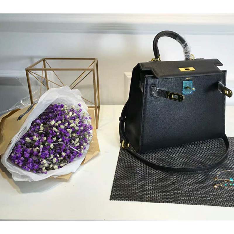 Side profile showing structured silhouette of Hermes Kelly Sellier 32 Bag Black