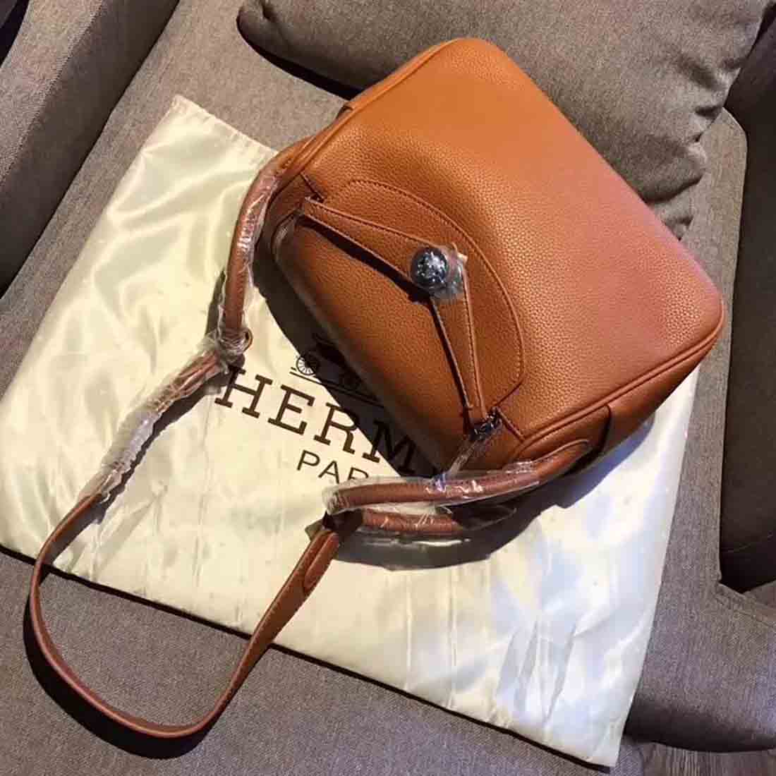 Side angle showing adjustable strap detail on Hermes Lindy 30 Top Flap Bag