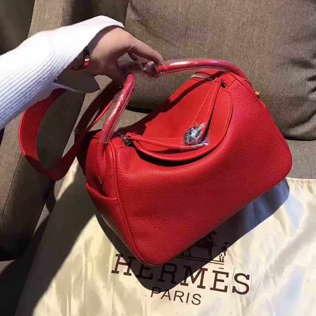 Side profile highlighting leather texture of Hermes Lindy 30 Top Flap bag