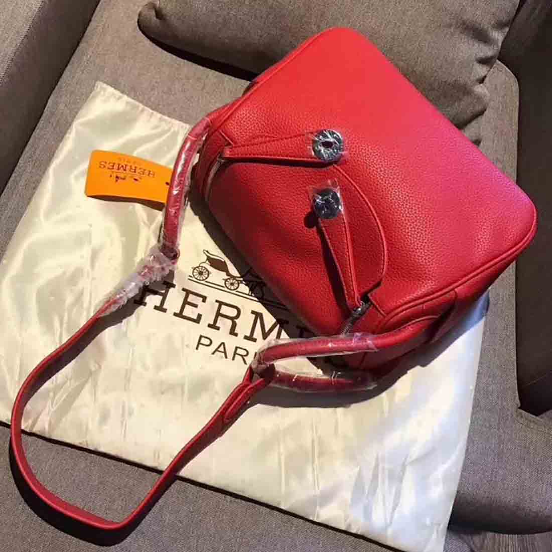Close-up of polished silver hardware on Hermes Lindy 30 red bag