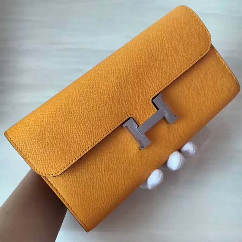 Close-up of polished H clasp on Hermes Women Constance Long Wallet