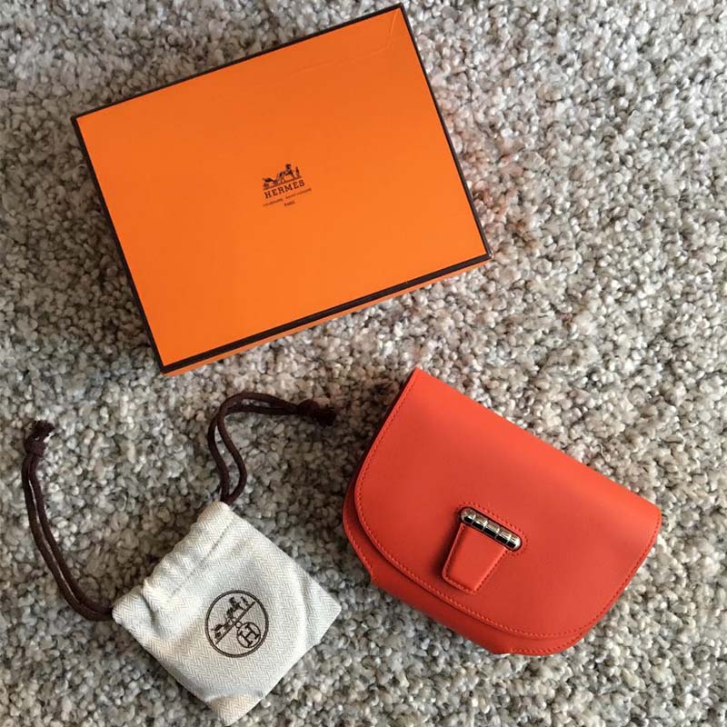 Side profile showing adjustable strap on Hermes Women Convoyeur Mini Bag