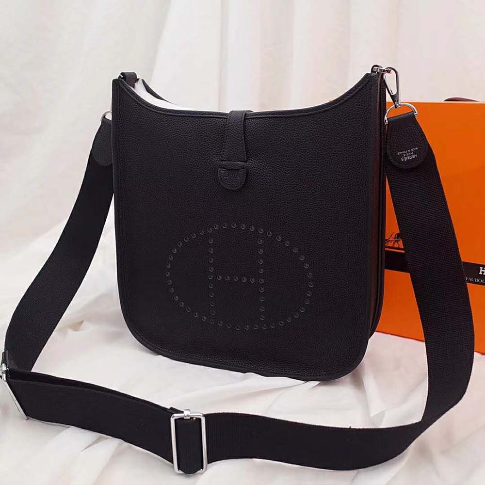 Side angle of Hermes Women Evelyne III 33 Bag-Black with adjustable strap visible