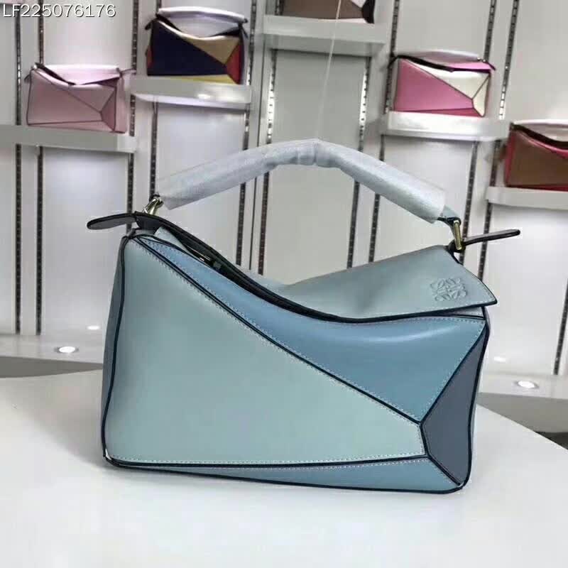 Side angle showing strap handle and silhouette of Loewe Puzzle Multi-color Bag