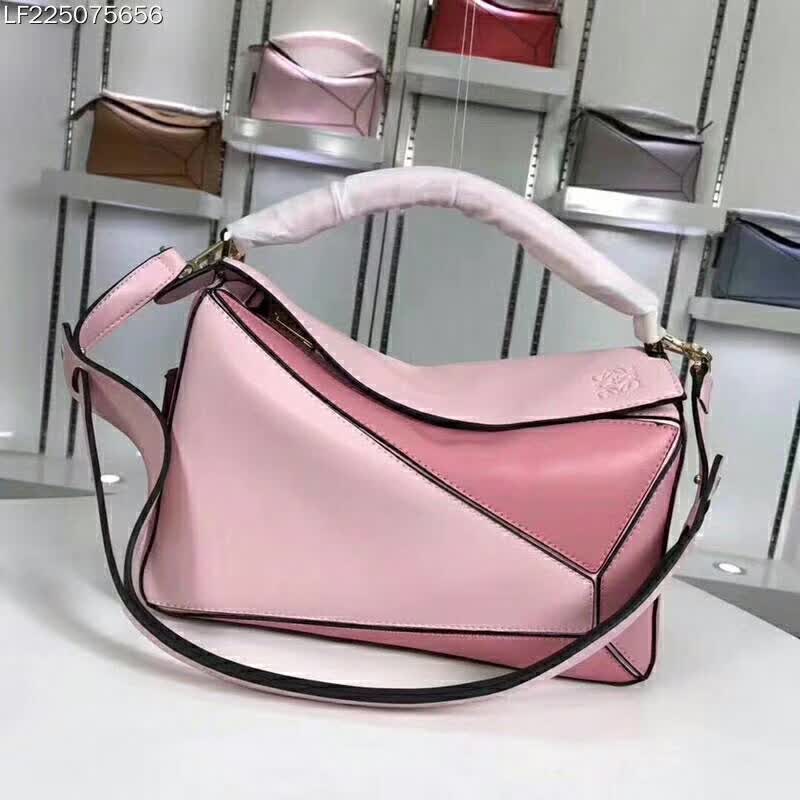 Side profile showing Loewe Puzzle Multi-color Bag strap handle