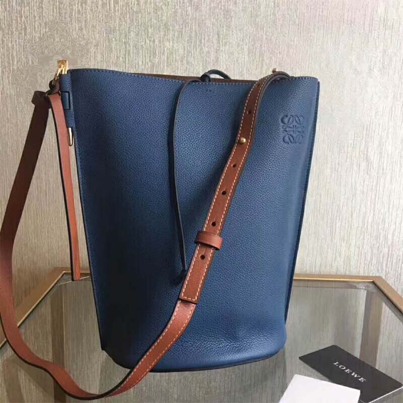 Side profile showing silver hardware on Loewe Women Gate Bucket Bag Light In Calfskin-Blue