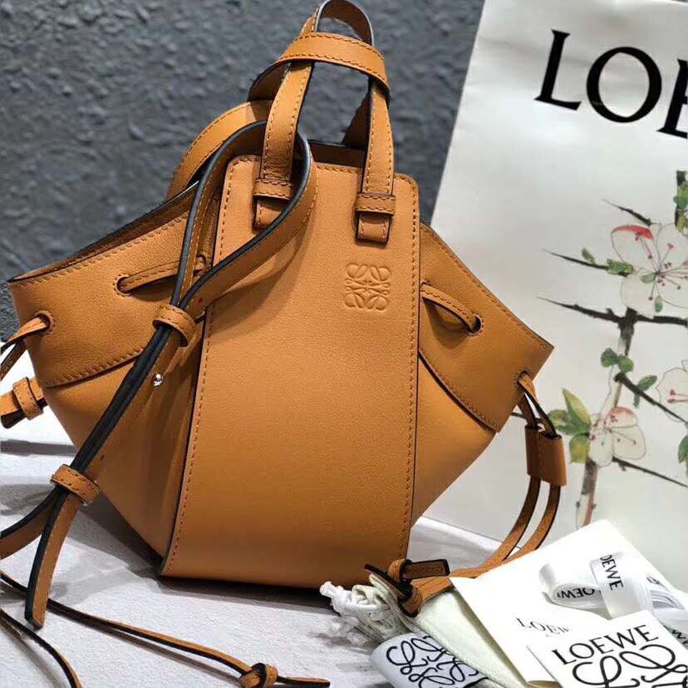 Side angle showing adjustable strap and gold hardware on Loewe Women Hammock Small Bag