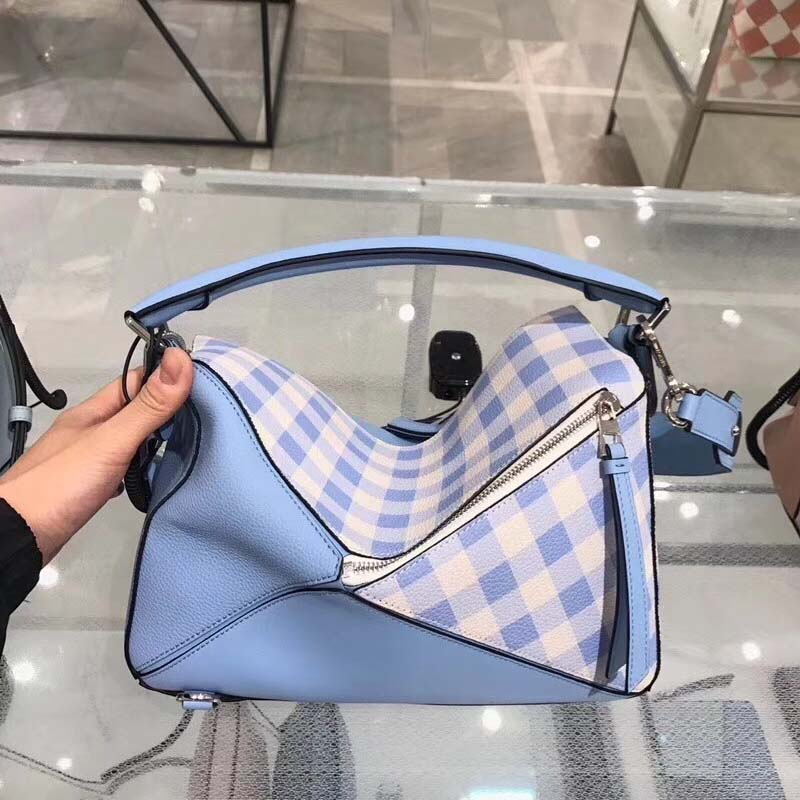 Side angle showing geometric puzzle silhouette of Loewe Calfskin Bag