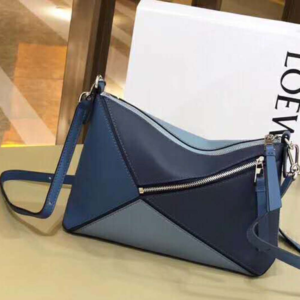 Side profile showcasing the geometric design of Loewe Women Puzzle Small Bag Varsity Blue Multitone