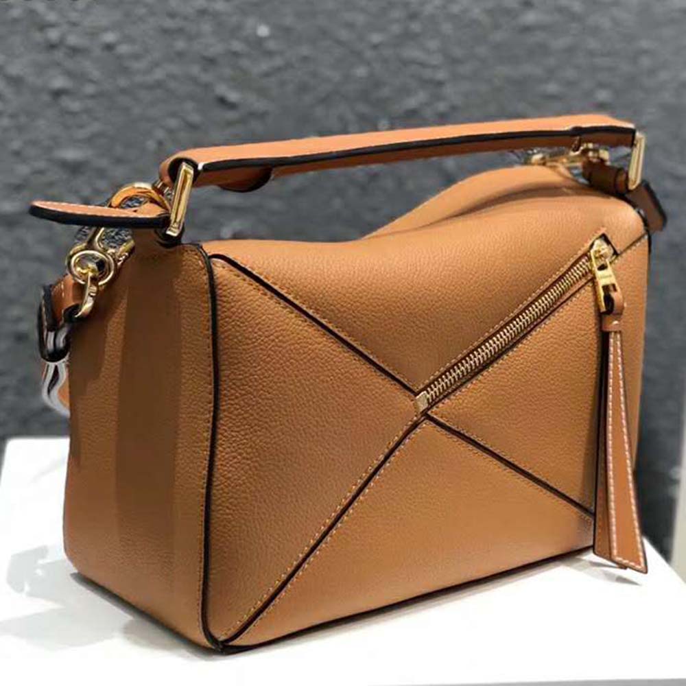 Side view showing geometric puzzle silhouette of Loewe Women Puzzle Small Bag