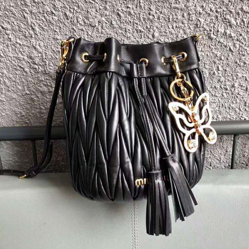 Close-up of silver-tone hardware on Miu Miu Women Matelasse Leather Bag-Black
