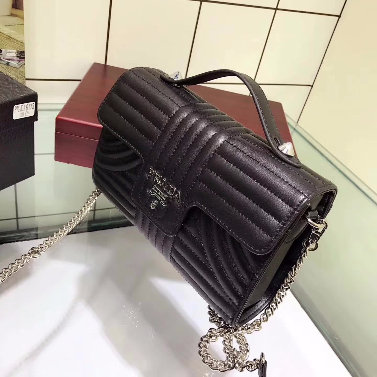 Side profile showing structured silhouette of Prada Diagramme Big Leather Handbag