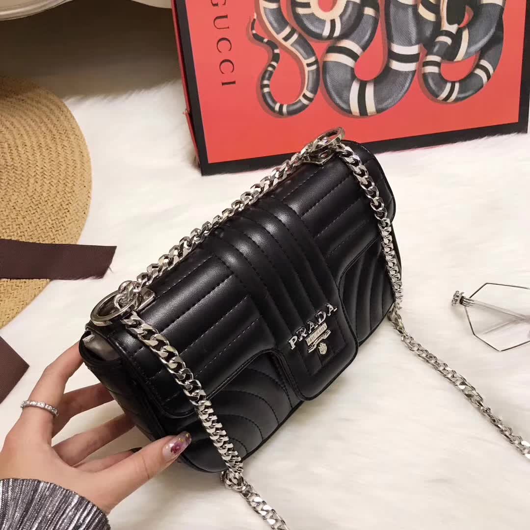 Side profile showing compact size of Prada Diagramme Small Leather Shoulder Bag