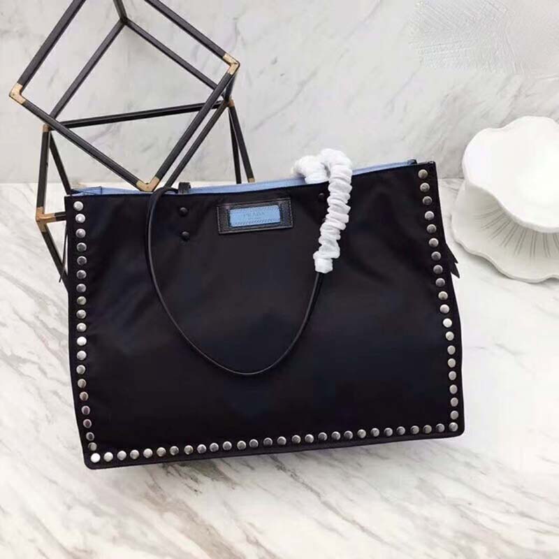 Close-up of silver metal stud trim on Prada Etiquette Fabric Tote Black