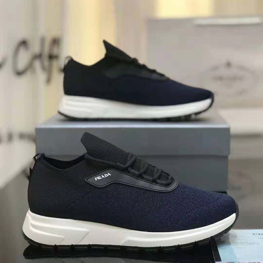 Rear angle highlighting subtle Prada logo on heel of PRAX 01 Knit Fabric Sneakers-Navy