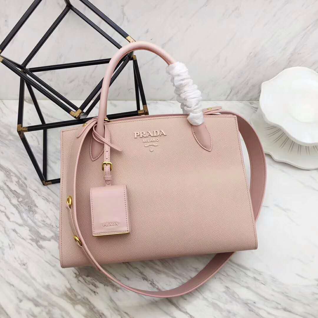 Close-up of pink leather texture and silver logo on Prada Monochrome Handbag