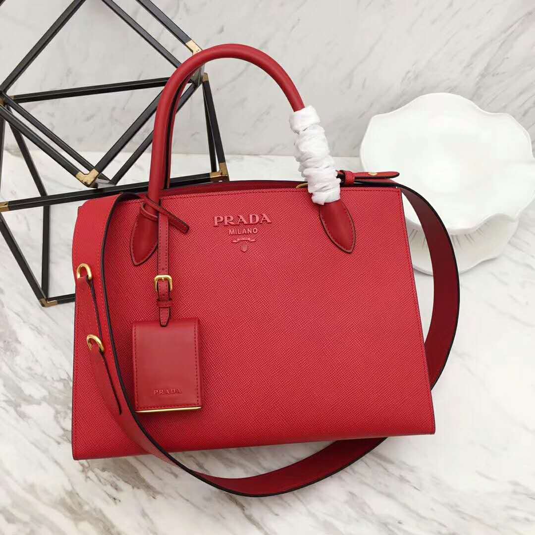 Close-up of Prada logo and silver hardware on handbag flap