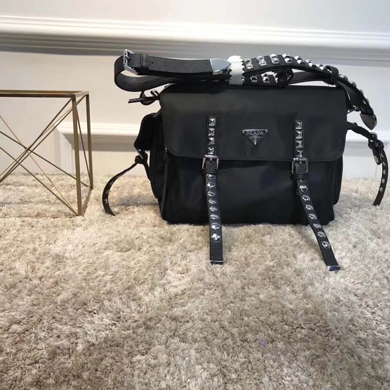 Close-up of calf leather trim and Prada logo hardware on shoulder bag
