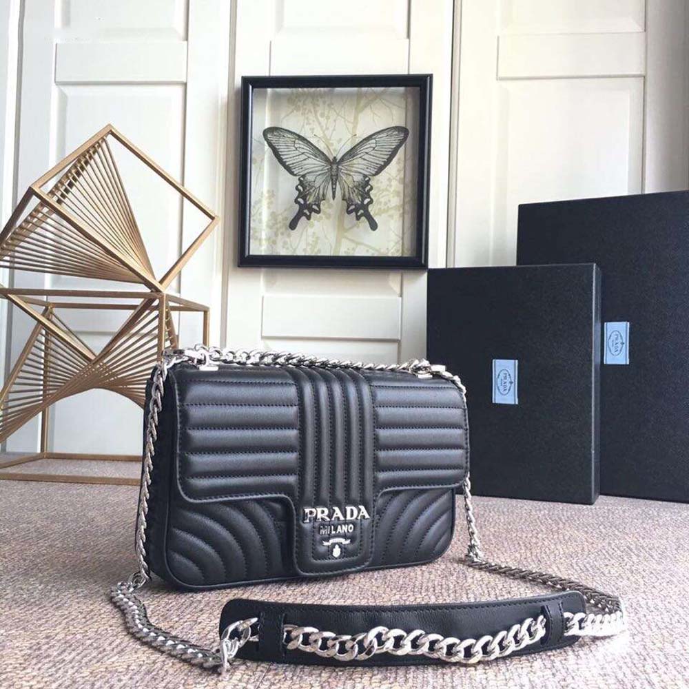 Close-up of silver-tone hardware on Prada Women Diagramme Leather Shoulder Bag-Black
