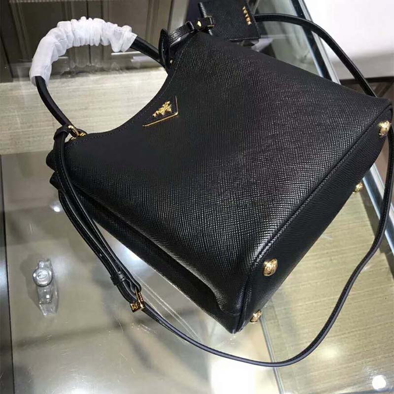Side angle showing structured silhouette of Prada Women Double Medium Bag