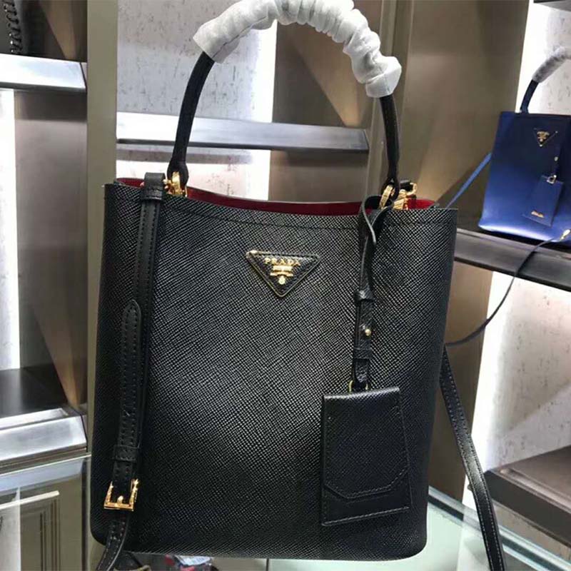 Close-up of gold-tone hardware on Prada Women Double Medium Bag