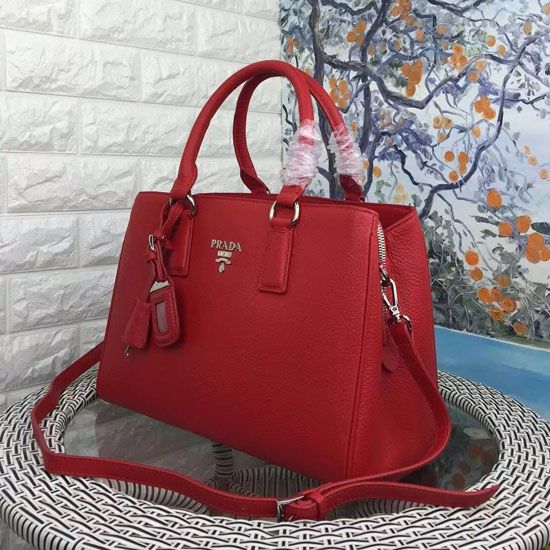 Side angle showing adjustable strap and closure on Prada Women Double Saffiano Leather Bag-Red