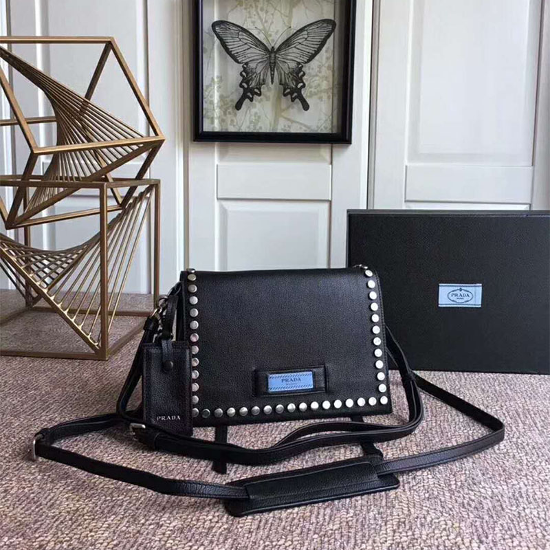 Close-up of matte silver-tone closure on Prada Women Etiquette Bag