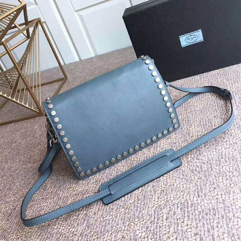 Side profile showing structured silhouette of Prada Women Etiquette Bag