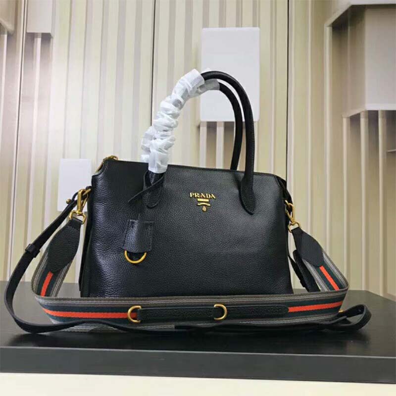Side angle highlighting smooth black leather and silver hardware