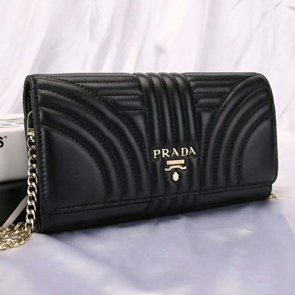 Side angle showing smooth calfskin texture of Prada Women Leather Mini Bag