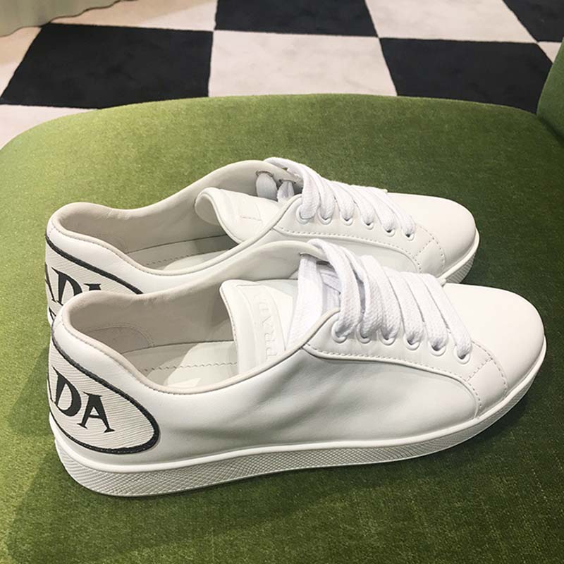 Close-up of lace-up closure on Prada Women Leather Sneakers Applique Shoes White