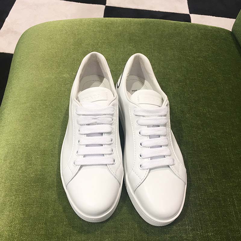 Top angle displaying smooth leather texture on Prada Women Leather Sneakers Applique Shoes White