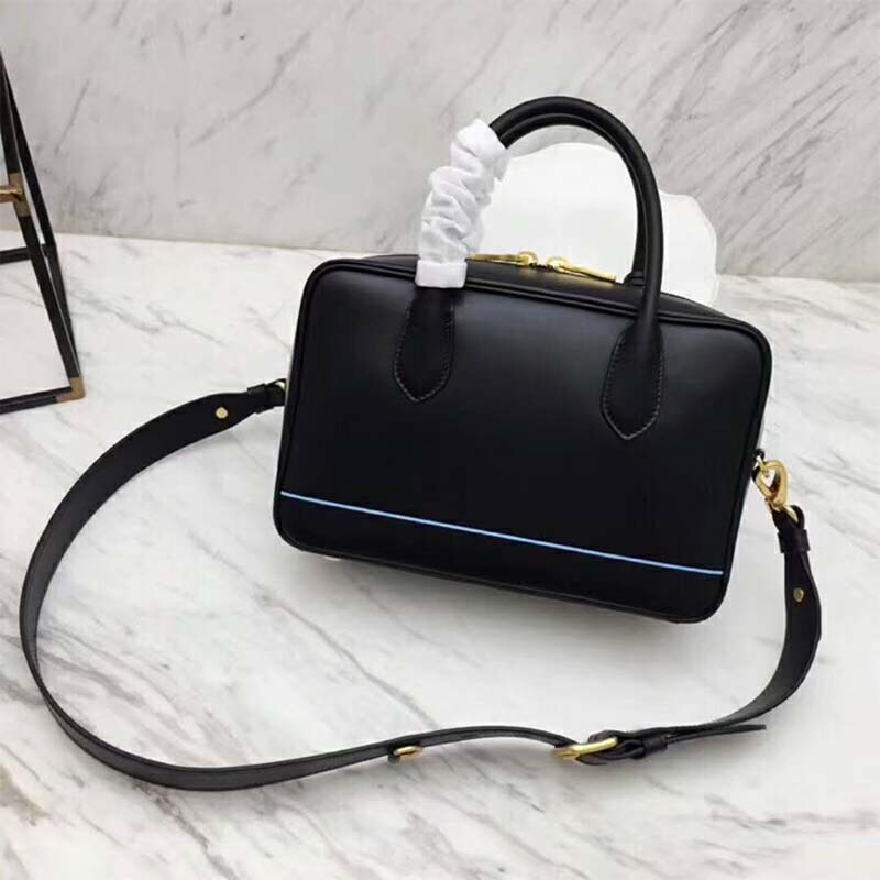 Side angle showing smooth black leather texture of Prada Women Mirage Small Leather Bag-Black