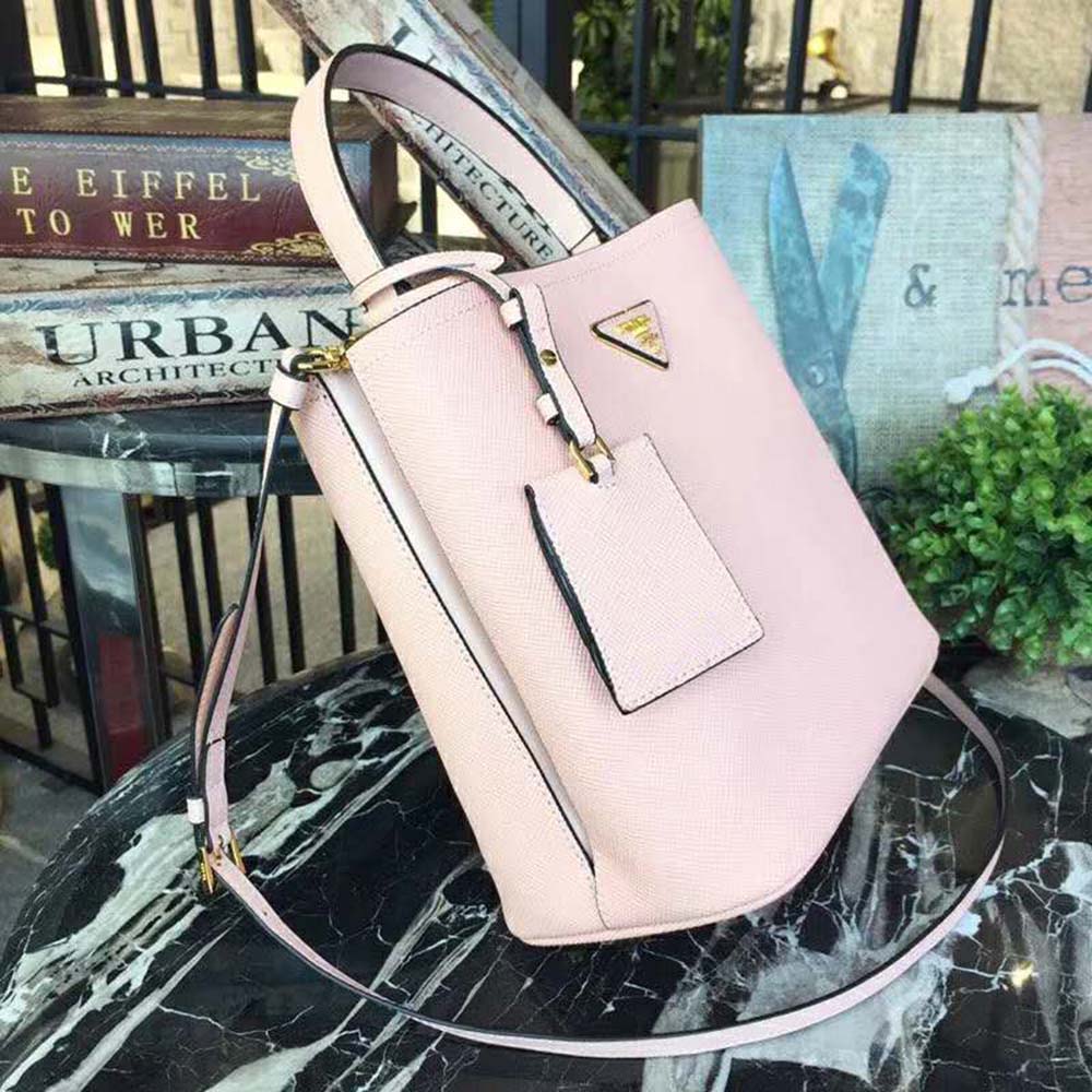 Side angle showing silver hardware and structured silhouette of Prada bag