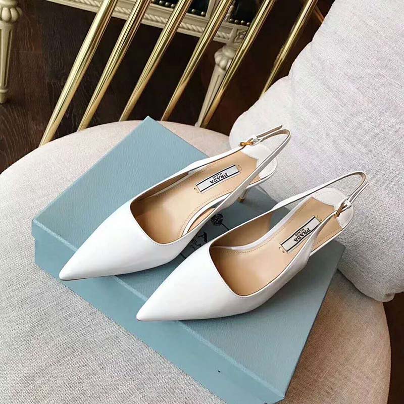 Close-up of pointed toe and leather texture on Prada white slingback pumps