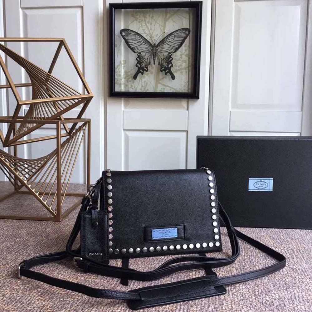 Close-up on gold-tone hardware and Prada logo on Etiquette Bag-Black
