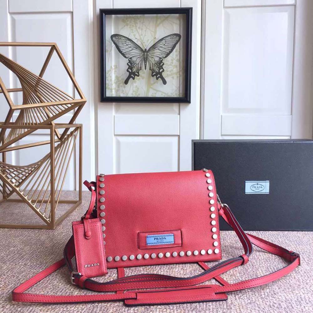 Close-up of silver Prada logo on Prada Women Prada Etiquette Bag-Red