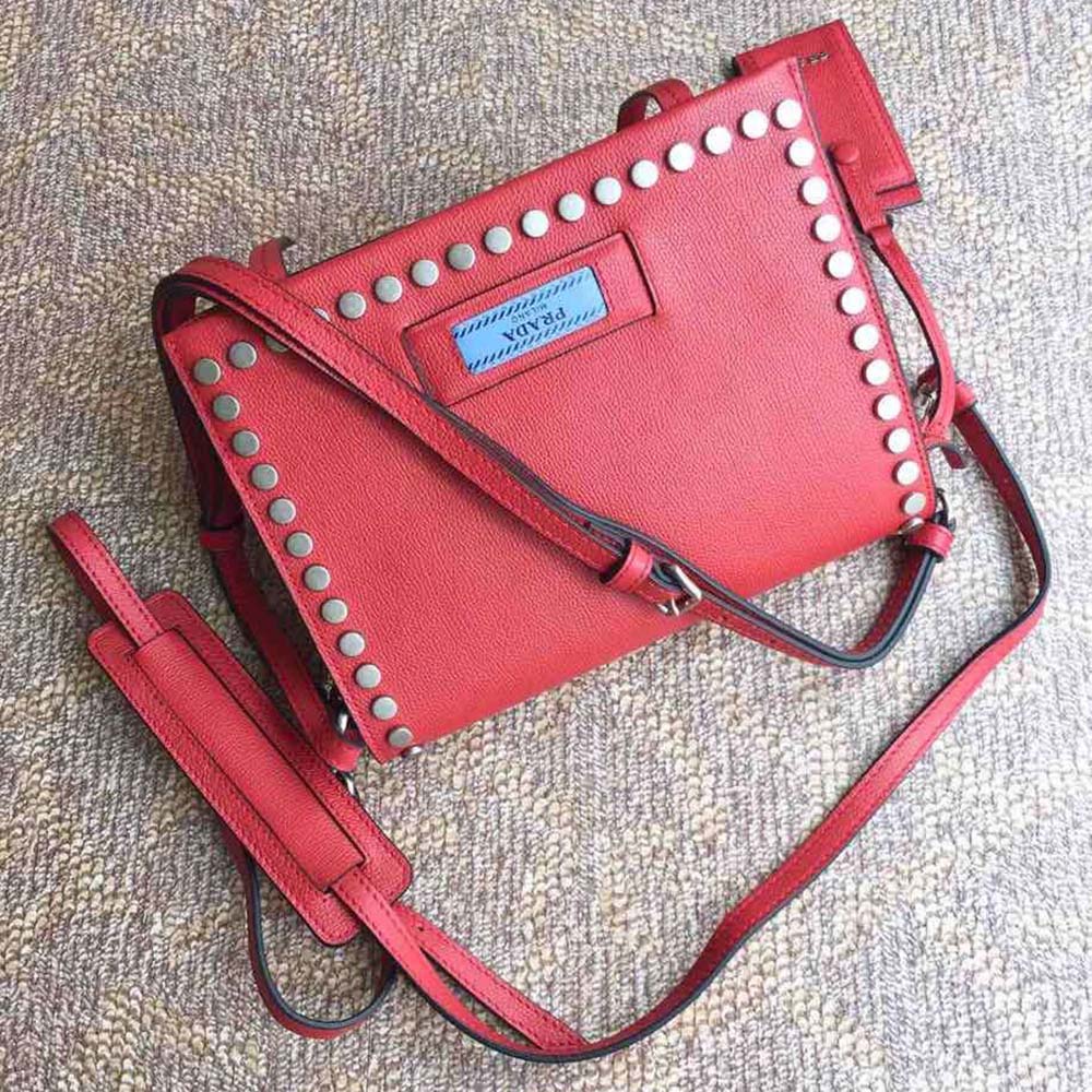 Side angle highlighting shape and strap of Prada Women Prada Etiquette Bag-Red