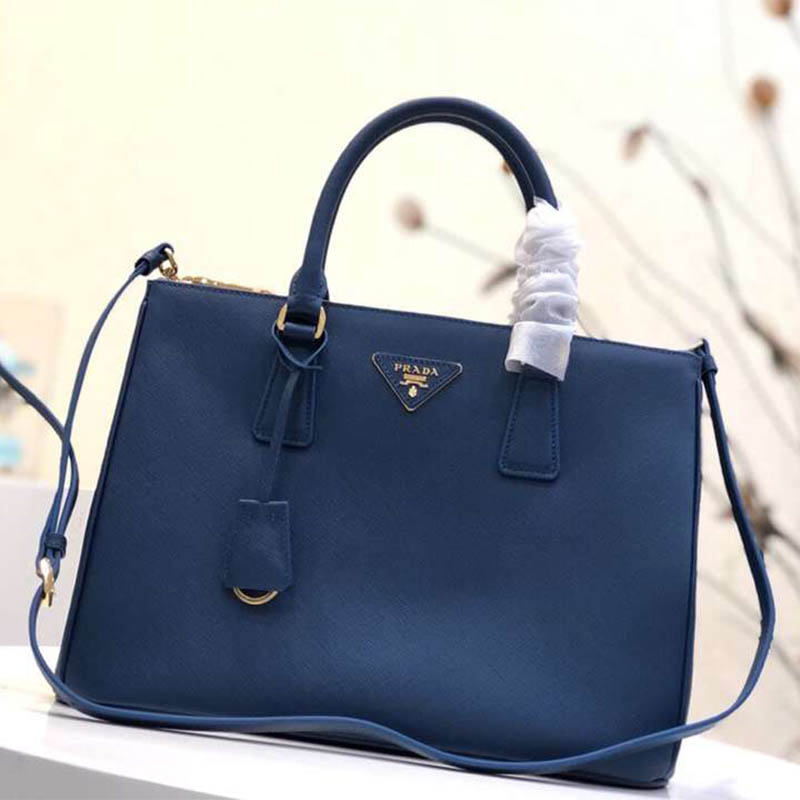 Close-up detail of gold hardware on Prada Women Prada Galleria Bag in Blue