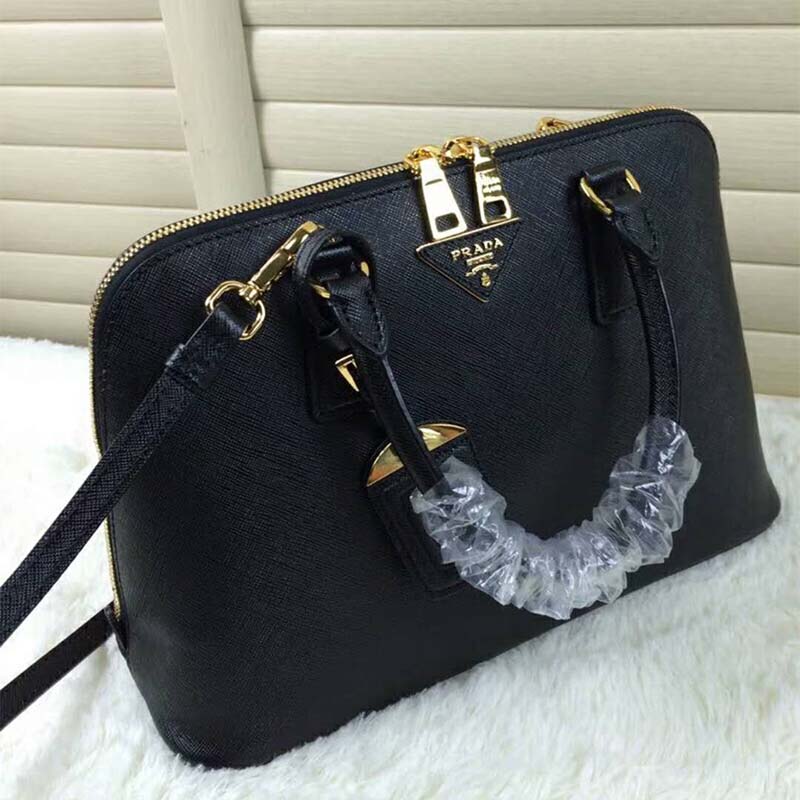 Close-up of gold-tone hardware on Prada Women Promenade Saffiano Leather Bag