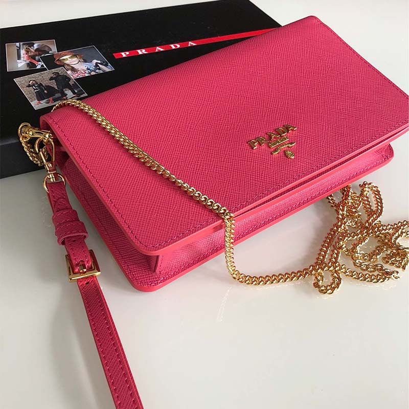 Close-up of pink saffiano leather texture and silver hardware on Prada mini bag