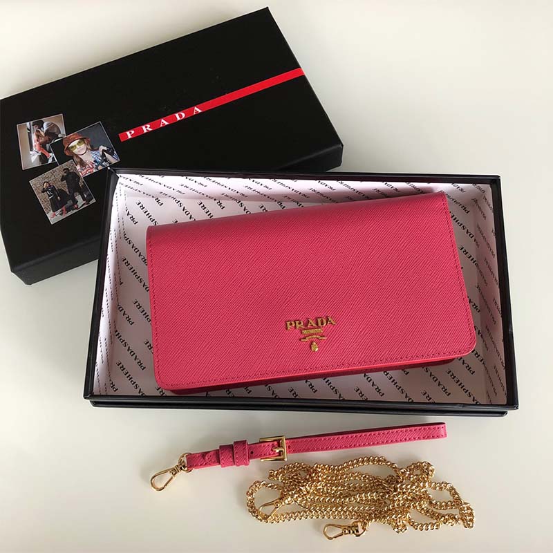 Side angle of Prada Women Saffiano Leather Mini Bag-Pink highlighting compact silhouette