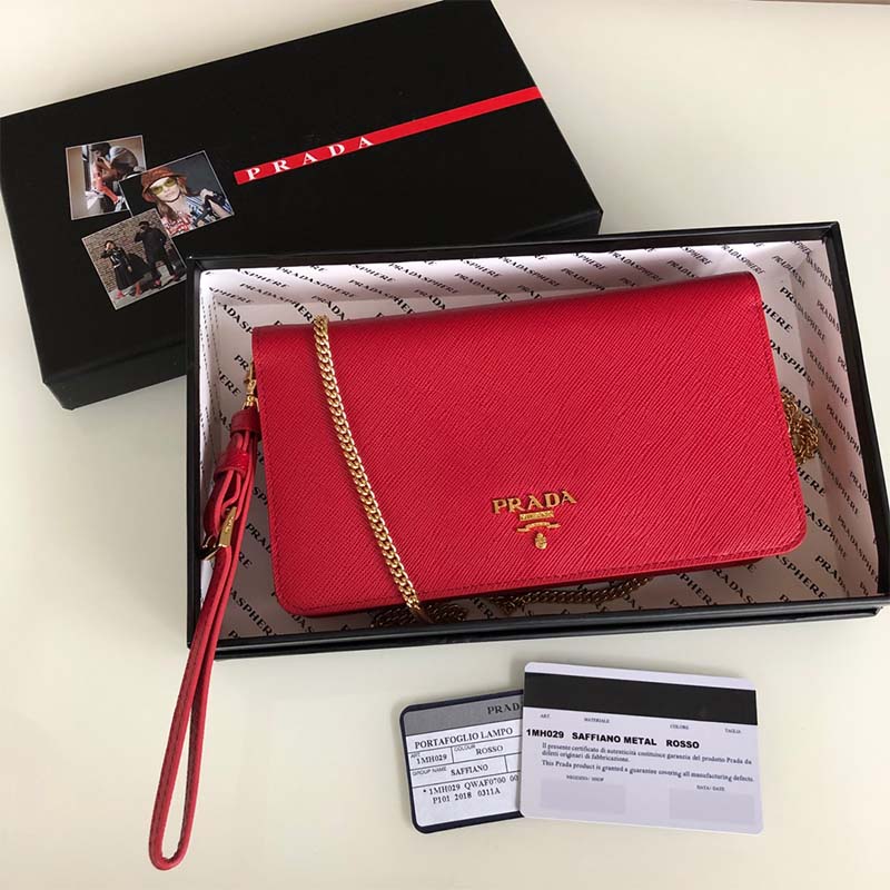Side angle of Prada Women Saffiano Leather Mini Bag-Red with gold hardware