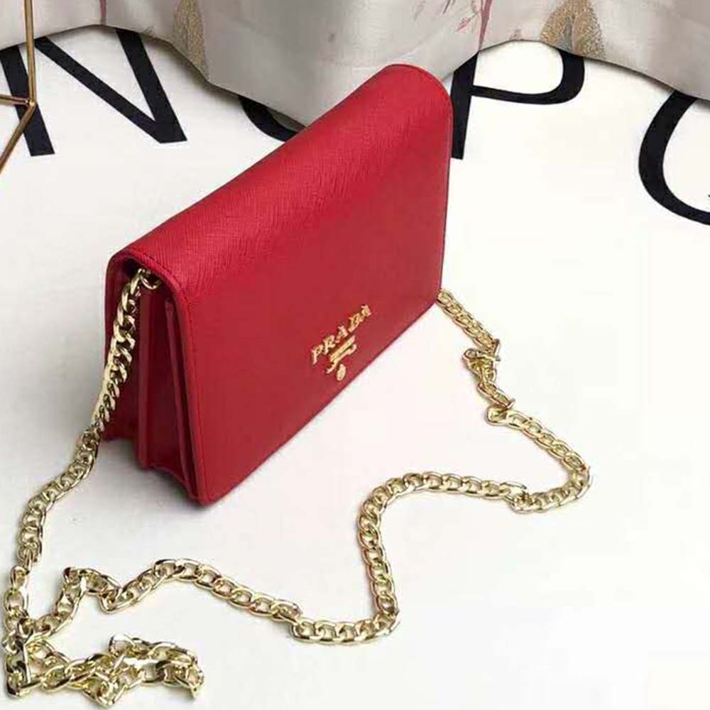 Side angle showing strap and textured saffiano leather detail on Prada bag