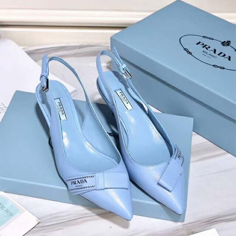 Close-up on blue leather and bow detail of Prada Women Shoes slingbacks