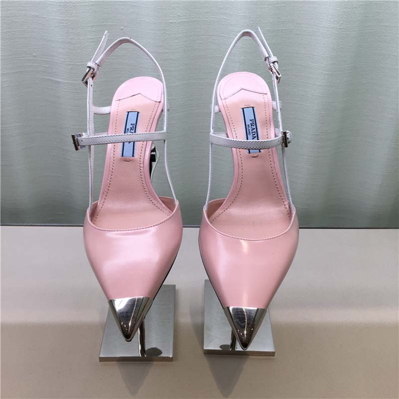 Close-up detail of pink two-tone leather and signature logo hardware