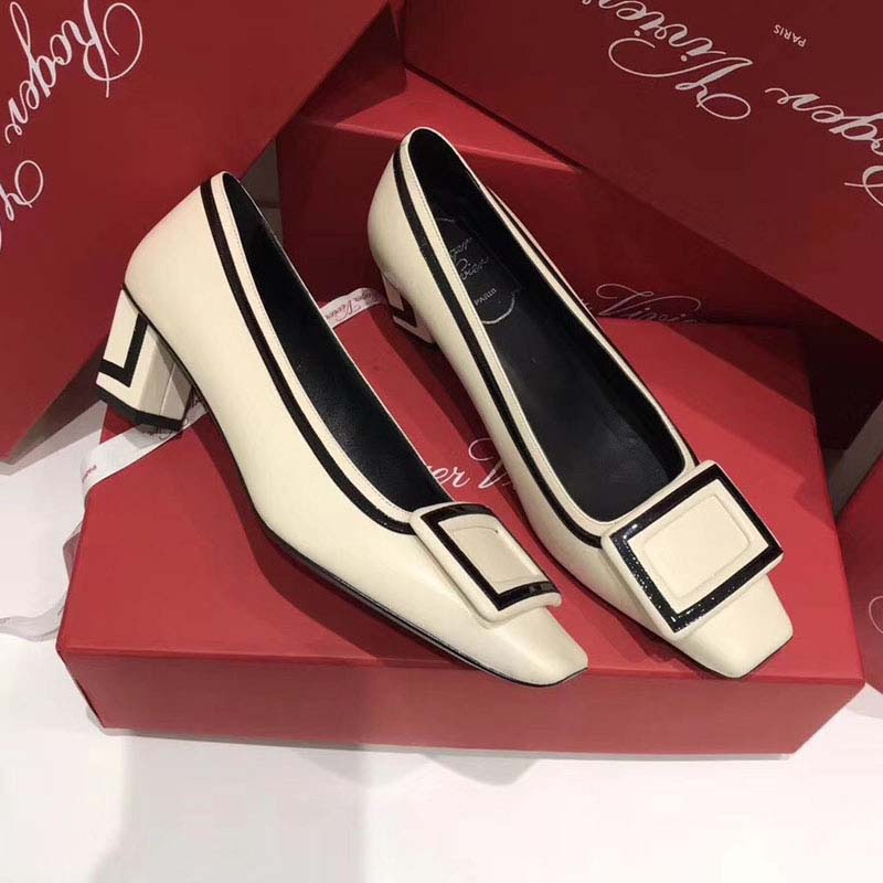 Close-up on signature silver buckle of Roger Vivier Belle Vivier Graphic Pumps