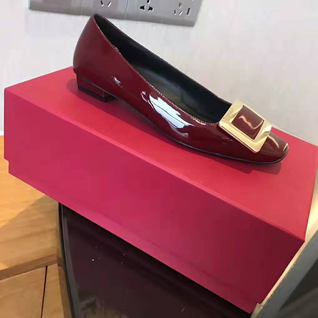 Close-up of signature buckle on Roger Vivier Belle Vivier Pumps in red