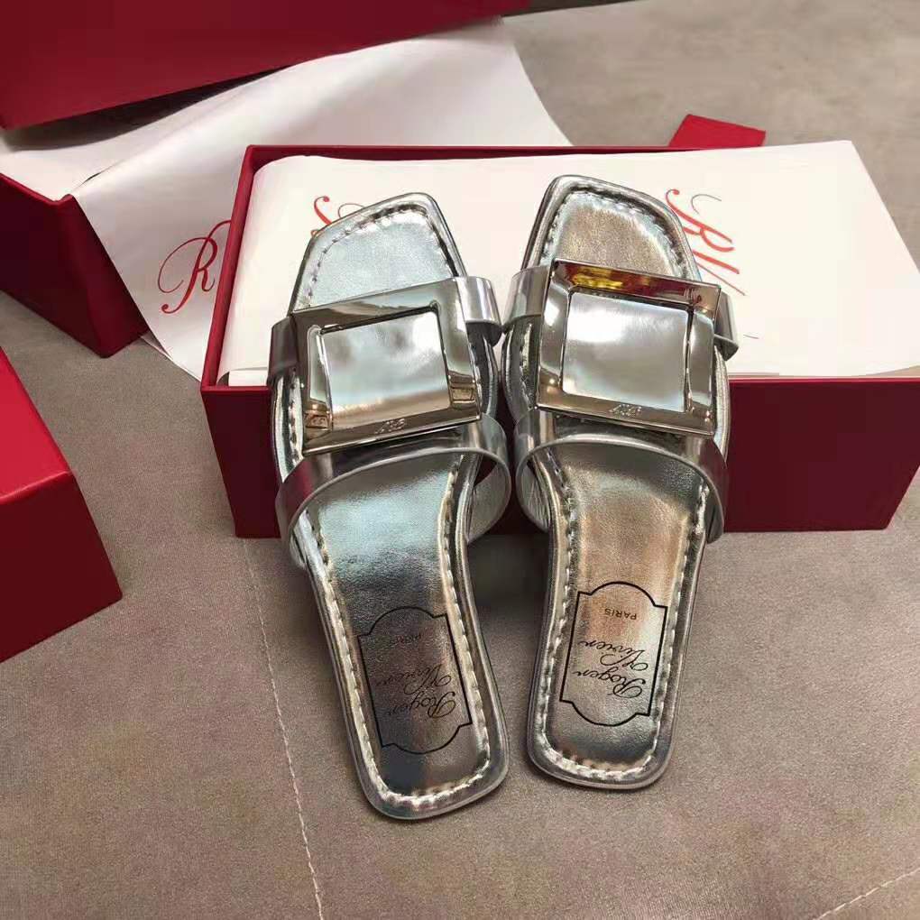 Close-up of oversized buckle detail on Roger Vivier Women Bikiviv’ Mules Flat Sandals-Silver