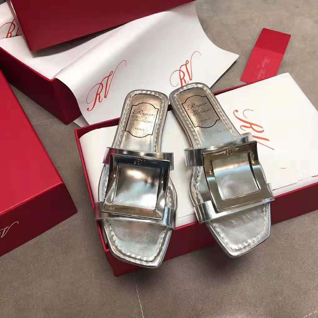 Side view showing slim flat sole of Roger Vivier Women Bikiviv’ Mules Flat Sandals-Silver